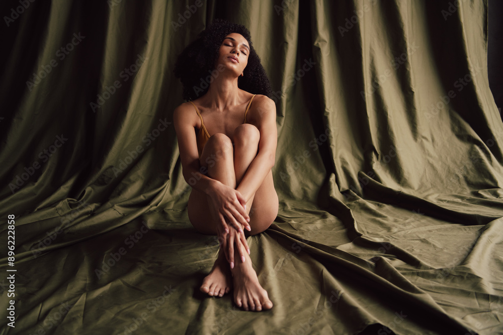No retouch photo of gorgeous charming dreamy girl in comfort underwear isolated on textile khaki color background No retouch photo of gorgeous charming dreamy girl in comfort underwear isolated on textile khaki color background