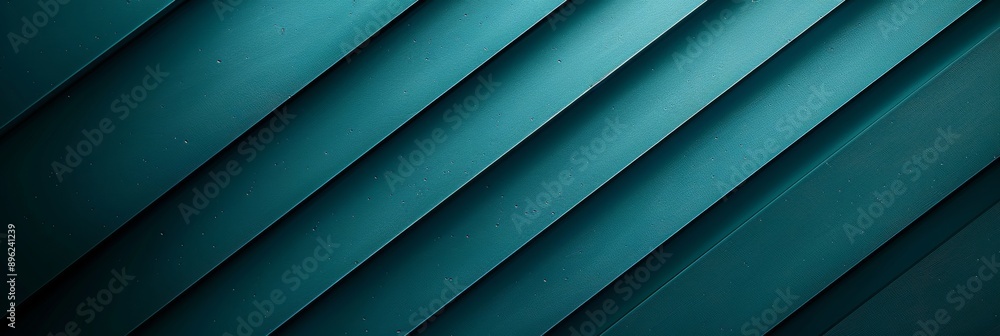 Obraz premium A close-up of a teal backdrop with diagonal lines that create a gentle gradient from dark to light shades