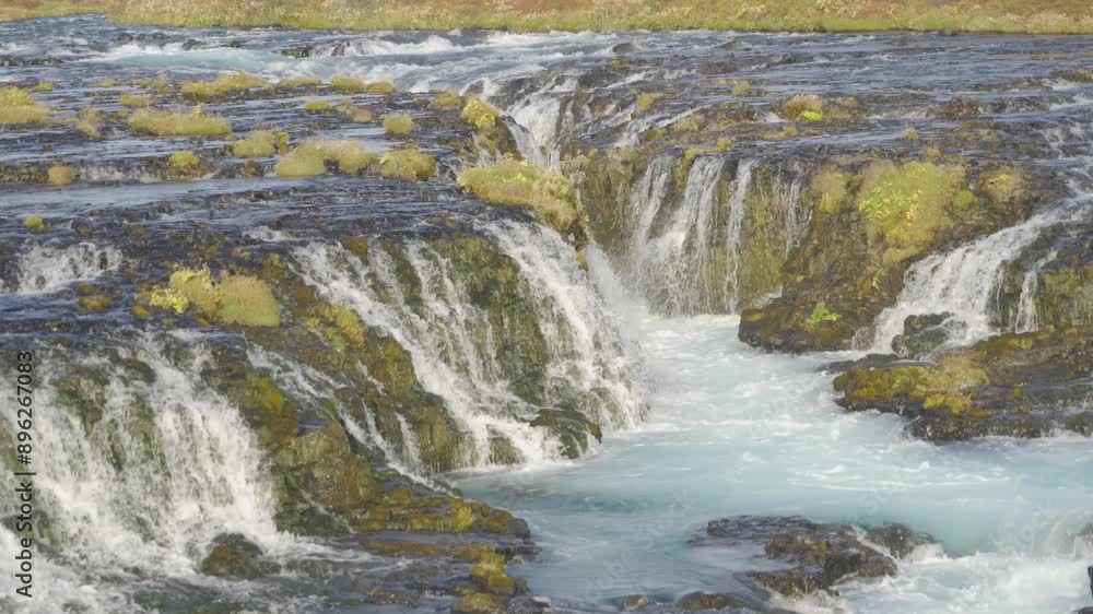 Bruarfoss waterfall in summer season in Iceland. Famous nature landscape background Bruarfoss waterfall in summer season in Iceland. Famous nature landscape background