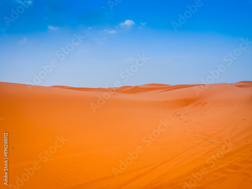 Sand dunes in the Sahara desert with blue sky in background, Merzouga, Morocco, North Africa