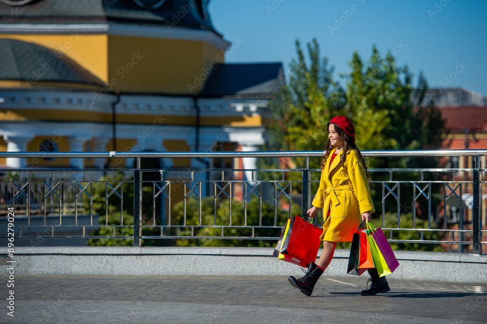 teen fashion girl after shopping in fall. autumn shopping sale. teenage girl go shopping in autumn coat. shopping sale and discount. girl shopper walking in autumn city. best sale offer. copy space teen fashion girl after shopping in fall. autumn shopping sale. teenage girl go shopping in autumn coat. shopping sale and discount. girl shopper walking in autumn city. best sale offer. copy space