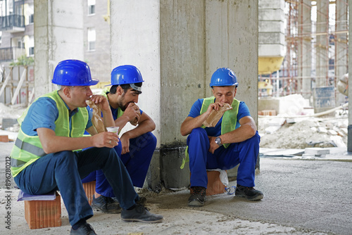 Construction industry concept architects and engineers discussing, lunch time