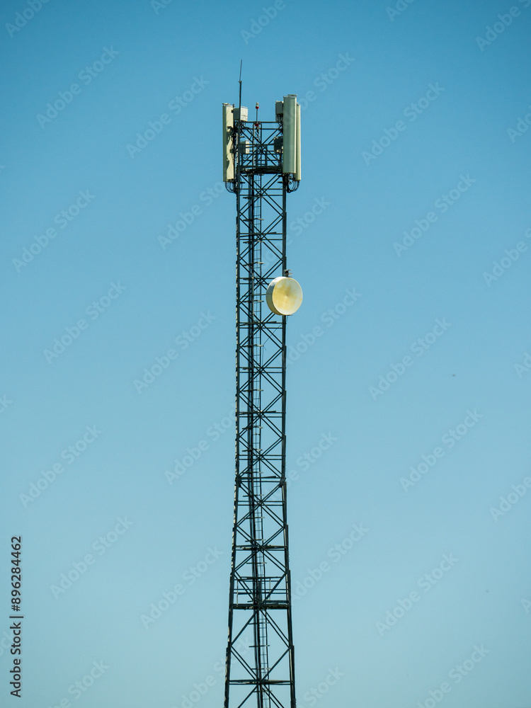 Cell tower, modern communication technology and infrastructure, vertical image Cell tower, modern communication technology and infrastructure, vertical image