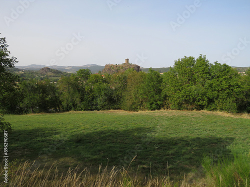 Beautiful green landscape with the view of the village of Polignac and the castle in the rear. Auvergne. France.