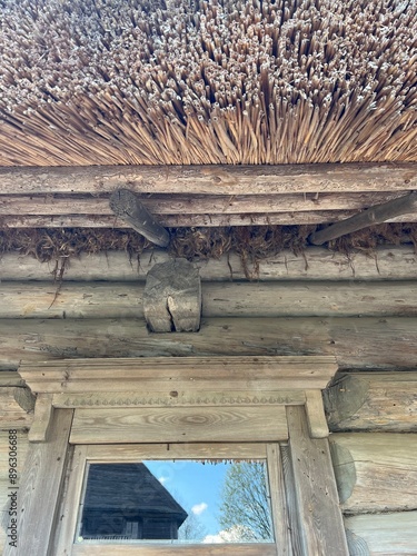 Side view of the wall of a log peasant house photo