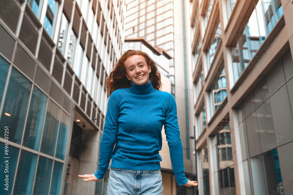 Woman in Blue Sweater Smiling in City Alleyway Woman in Blue Sweater Smiling in City Alleyway