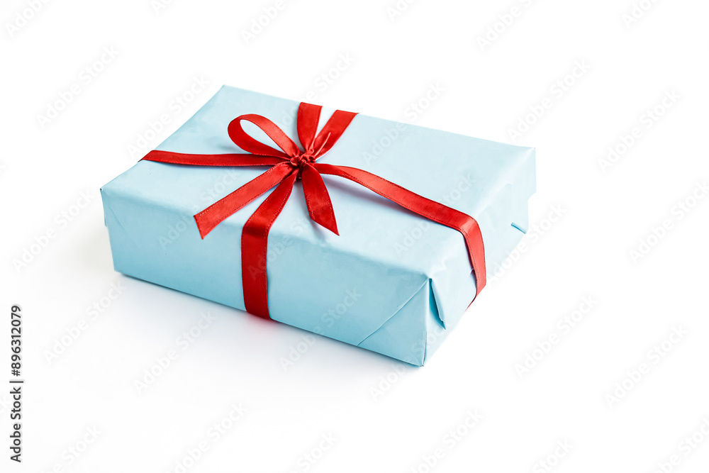 Fototapeta premium Blue Gift Box with Red Ribbon Isolated on White Background