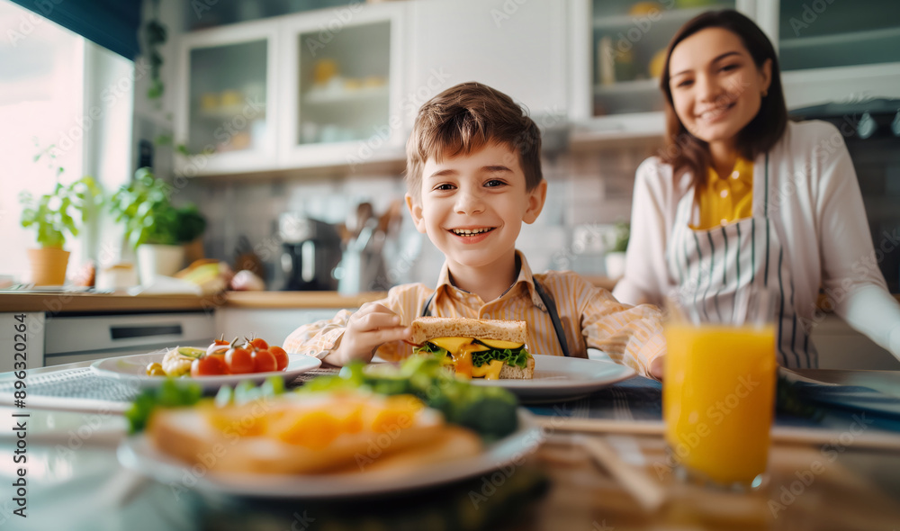 cheerful young boy enjoys healthy breakfast in bright modern kitchen with smiling mother. scene is filled with fresh fruits and vegetables. Warm moment perfect for promoting nutrition and family meals cheerful young boy enjoys healthy breakfast in bright modern kitchen with smiling mother. scene is filled with fresh fruits and vegetables. Warm moment perfect for promoting nutrition and family meals