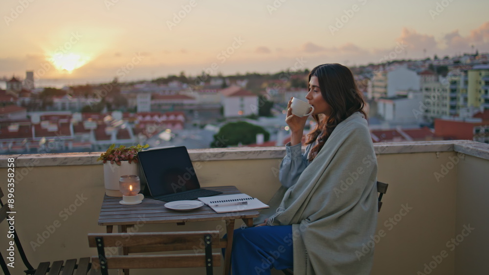 Reflective girl sipping cappuccino at sunrise cityscape balcony. Woman morning Reflective girl sipping cappuccino at sunrise cityscape balcony. Woman morning