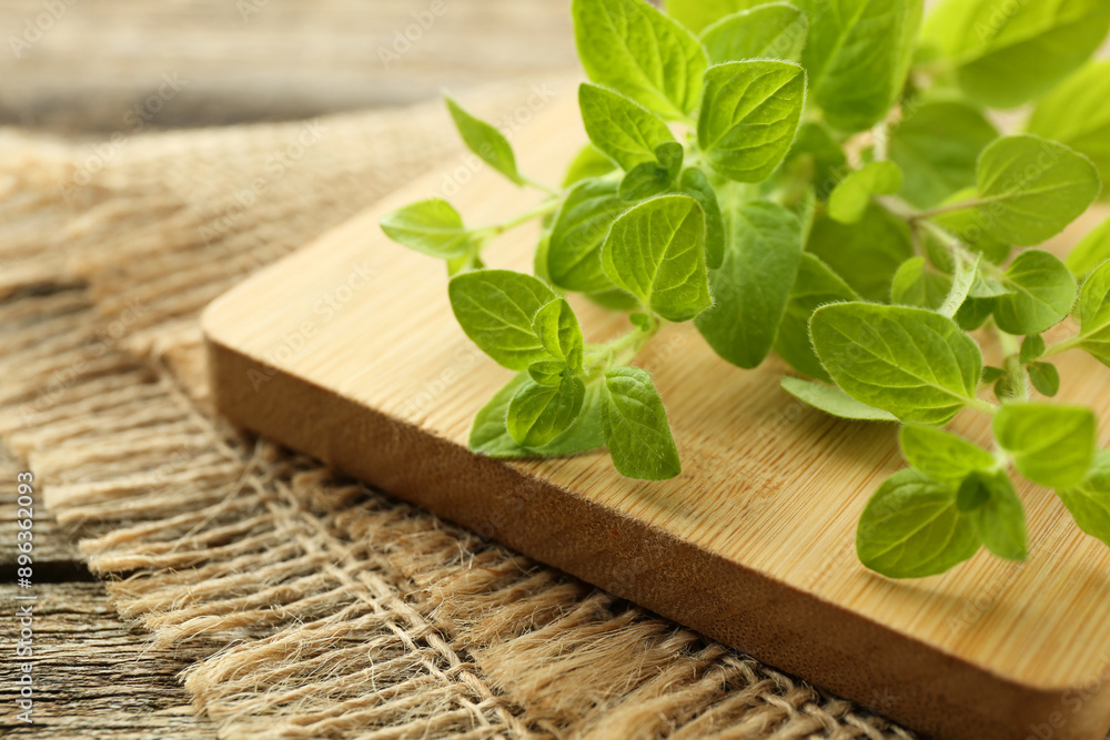 Sprigs of fresh green oregano on table, closeup Sprigs of fresh green oregano on table, closeup