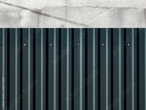 metal fence made of corrugated sheets close up