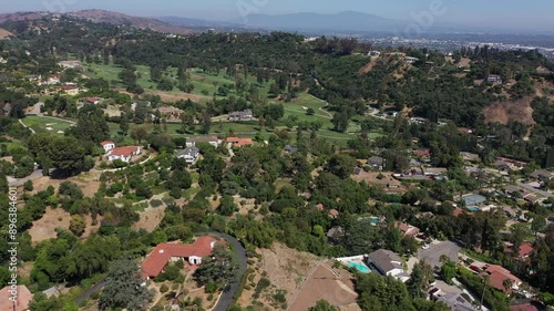 Afternoon aerial view of the sprawling neighborhood houses and hills of La Habra Heights, California, USA. photo