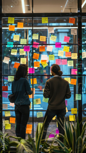 Wallpaper Mural Team brainstorming session with sticky notes on glass wall in a modern office, ideal for mobile Torontodigital.ca