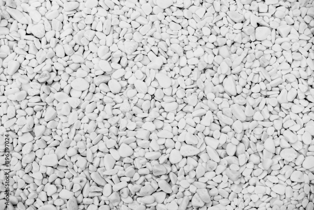 Close-up for oval pebbles of white gravel stones. White gravel as a decorative and architectural ingredient. Black and White picture