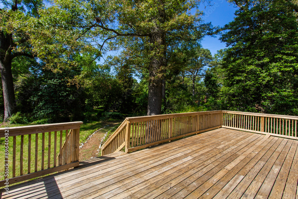 Large Wooden Deck With Panoramic Views Of A Lush Green Landscape Large Wooden Deck With Panoramic Views Of A Lush Green Landscape