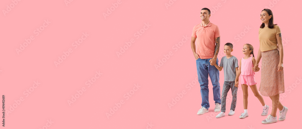 Fototapeta premium Happy family walking on pink background