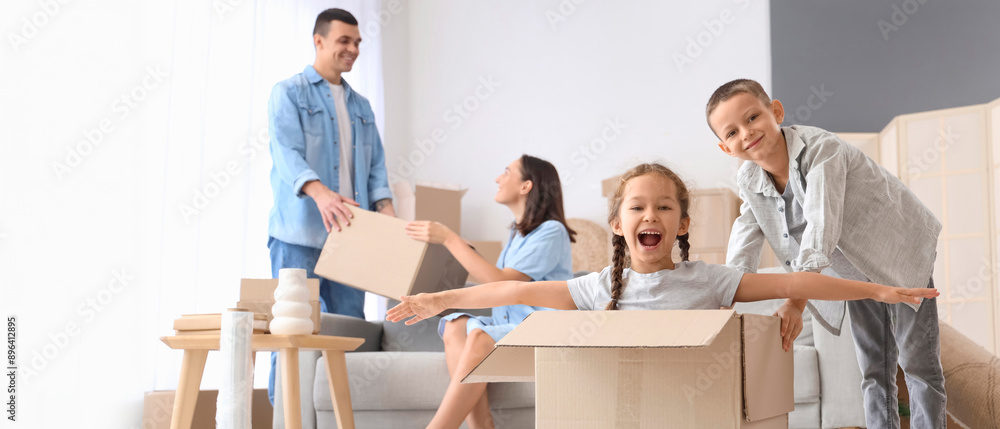 © Pixel-Shot - Little children having fun at home on moving day