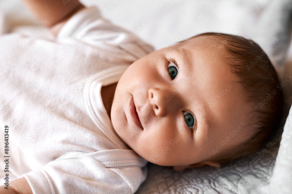 Baby, portrait and boy on bed with relax for wellness, child development or comfortable in bedroom. Lying down, newborn and infant kid in nursery for curiosity, growth or morning routine in home Baby, portrait and boy on bed with relax for wellness, child development or comfortable in bedroom. Lying down, newborn and infant kid in nursery for curiosity, growth or morning routine in home