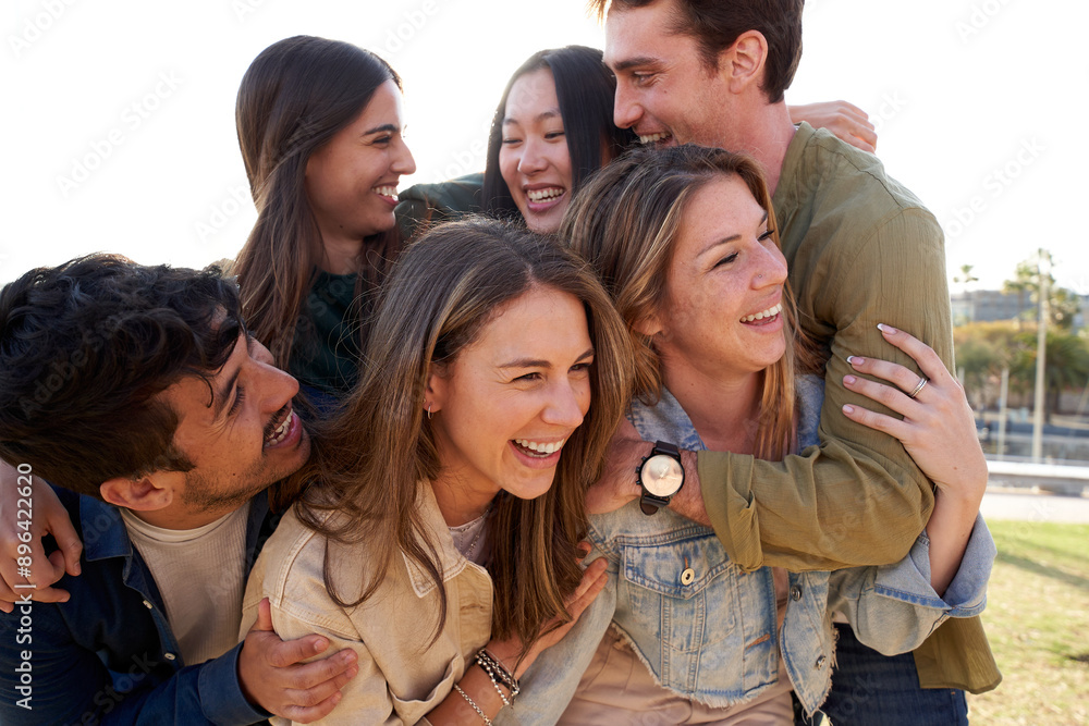 Fototapeta premium a group of young people are hugging each other in a park . High quality