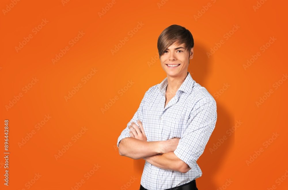 Happy young cheerful man hands crossed Happy young cheerful man hands crossed