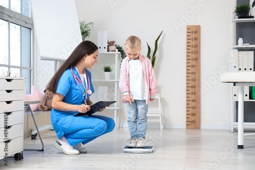 Female pediatrician with li...
