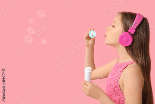 Cute girl in headphones blo...