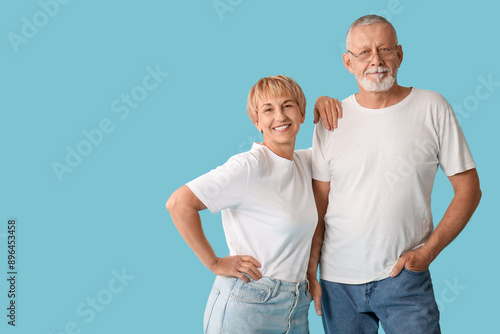 Mature couple on blue backg...