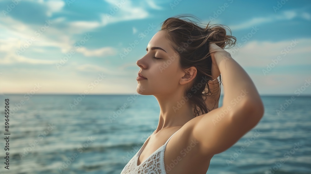 A young woman stretching arms above her head near ocean She is yoga practice near a beach during summer holiday : Generative AI A young woman stretching arms above her head near ocean She is yoga practice near a beach during summer holiday : Generative AI