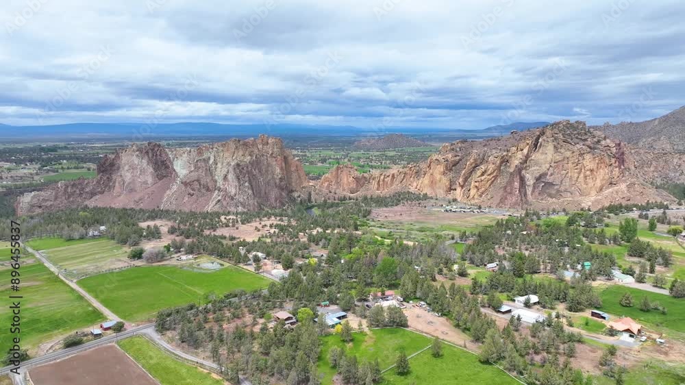 Aerial Tracking Shot of Smith Rock State Park with Farmlands Below Aerial Tracking Shot of Smith Rock State Park with Farmlands Below