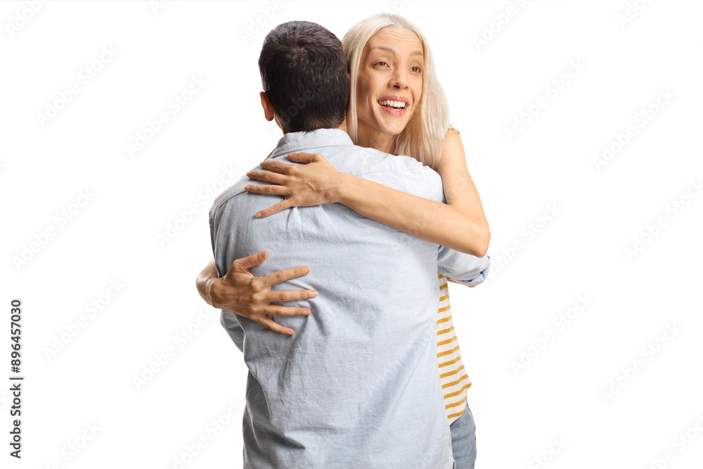 Happy young woman hugging a man Happy young woman hugging a man