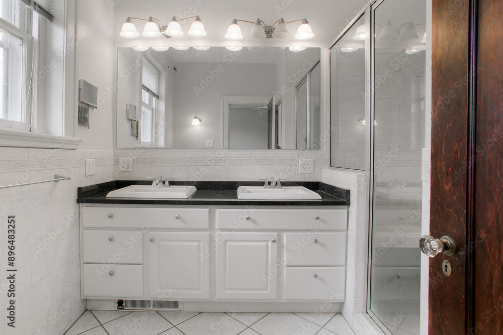 Modern Dual Sink Bathroom With Large Mirror And Glass Shower Enclosure Modern Dual Sink Bathroom With Large Mirror And Glass Shower Enclosure