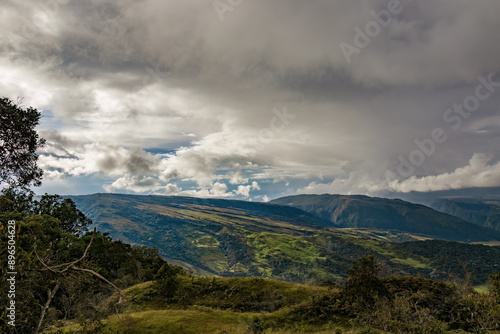 The magnificent landscape of the eastern Andean mountains of central Colombia, illuminated by the light of sunset on an overcast sky. photo