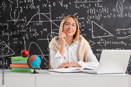 Mature female math teacher ...