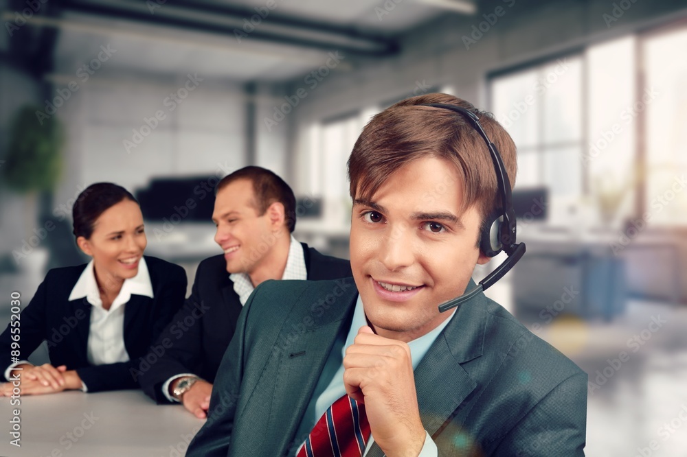 Happy group of smart IT professionals works in office