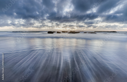 Ebb tide on the beach of Opononi, Far District, North Island New Zealand photo