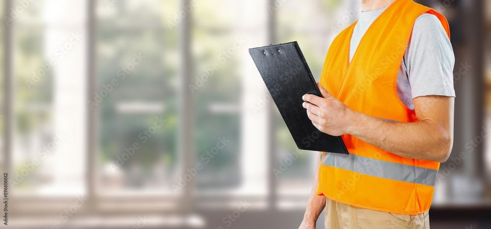 inspector or engineer at construction new house with checklist. inspector or engineer at construction new house with checklist.