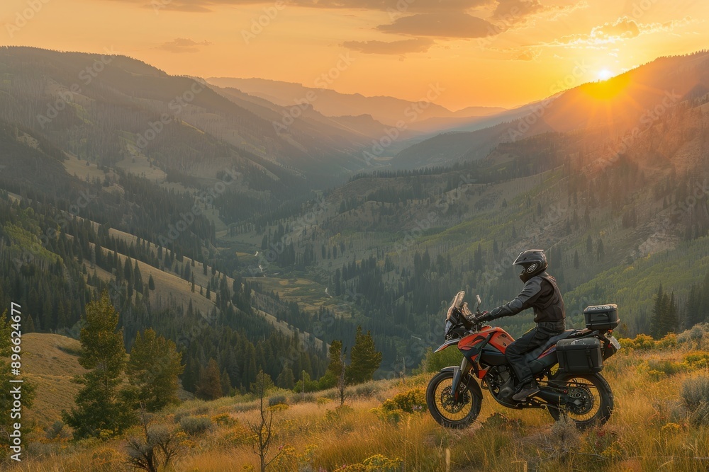 Motorcyclist enjoying sunset over valley. Motorcyclist enjoying sunset over valley.