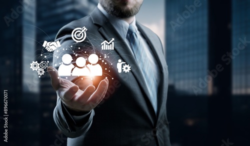 Fototapeta Naklejka Na Ścianę i Meble -  Employing CRM, businessman manages customer networks