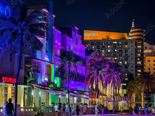 Foto Miami Beach, Florida - July 8, 2024: Art Deco buildings illuminated at night on Ocean Drive