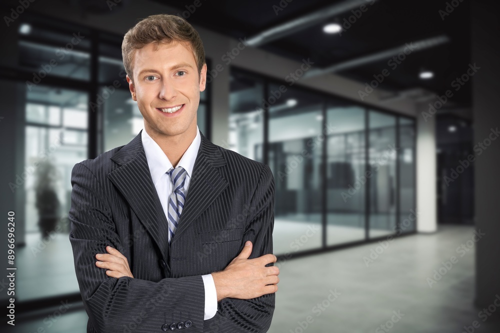 Portrait of successful smart businessman in office