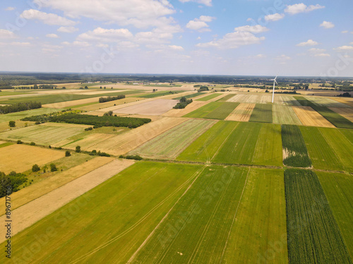 Aerial View of Countryside Fields with Blue Sky and White Clouds