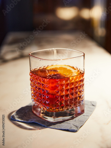 Negroni cocktail over a marble surface.