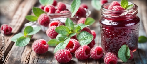 Picture of raspberry glass jar raspberry jam wooden table is fil photo