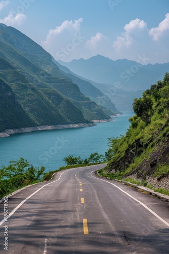 Realistic image of an empty road in front of a mountain view. and blue sea