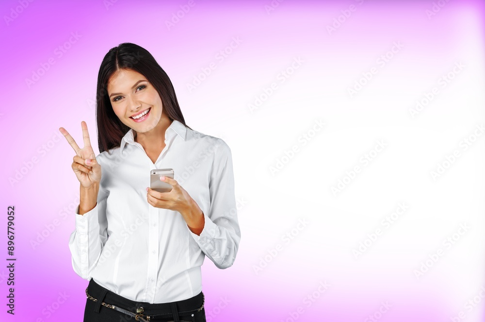 A young happy woman hold a smartphone A young happy woman hold a smartphone