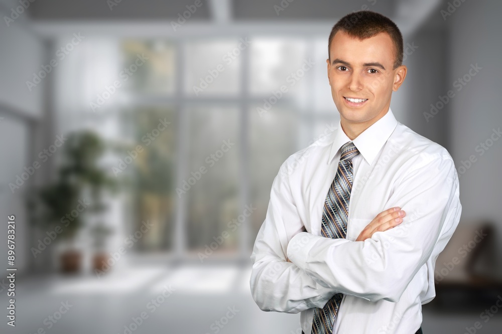 Happy business man looking at camera posing Happy business man looking at camera posing