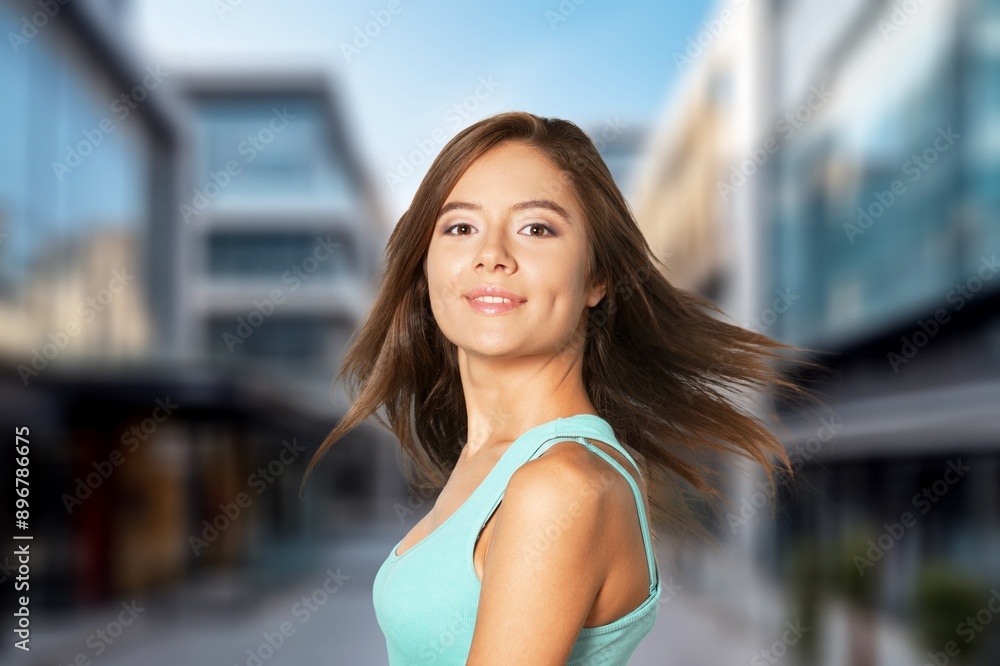 Beautiful happy young woman posing on the street. Beautiful happy young woman posing on the street.