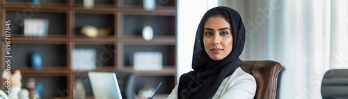 Saudi Arabian businesswoman in a luxurious office, highend business success photo