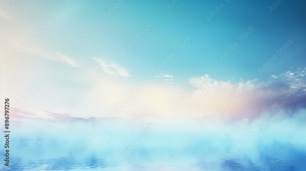 Obraz premium Water fog that rises above the calm lake or river surface under the blue sky. A lake or river scenery filled with water fog.