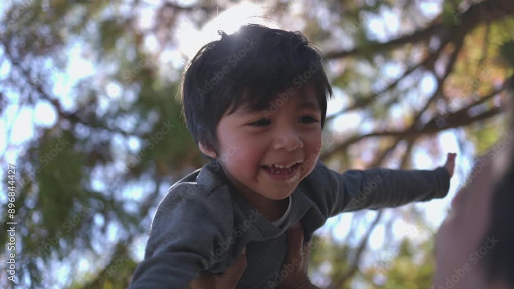 Mexican little boy playing with his father outside, international children day rights Mexican little boy playing with his father outside, international children day rights